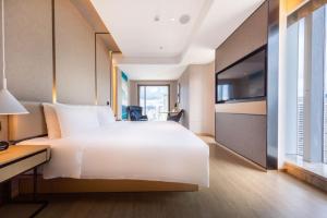 Voodi või voodid majutusasutuse Atour S Hotel Zhuhai Gongbei Port NetEase Selected toas