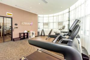 a gym with treadmills and cardio equipment in a building at Atour Light Hotel Guiyang Fountain in Guiyang