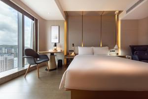 Voodi või voodid majutusasutuse Atour S Hotel Zhuhai Gongbei Port NetEase Selected toas