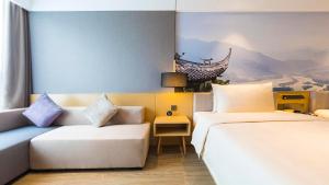 Postel nebo postele na pokoji v ubytování Atour Hotel Chengdu Jiuyanqiao NetEase Selected
