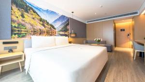 Postel nebo postele na pokoji v ubytování Atour Hotel Chengdu Jiuyanqiao NetEase Selected
