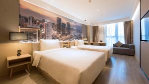 Postel nebo postele na pokoji v ubytování Atour Hotel Chengdu Jiuyanqiao NetEase Selected