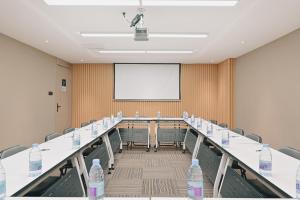 a conference room with a long table with water bottles on it at Atour Hotel Beijing Dahongmen Yintai in Beijing