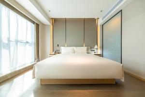 Voodi või voodid majutusasutuse Atour S Hotel Zhuhai Gongbei Port NetEase Selected toas