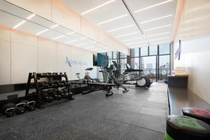 a fitness room with a gym with weights at Atour Hotel Chengdu Jinniu Southwest Jiaotong University in Chengdu