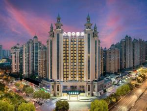 a large building with tall towers in a city at Atour Hotel Hefei Pearl Plaza Huijin Business Center in Hefei