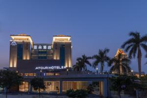 a night view of the apollo hotel at Atour Hotel Xiamen Jimei University in Xiamen