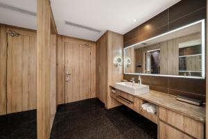 a bathroom with a sink and a mirror at Atour Hotel Chengdu Consulate South Renmin Road in Chengdu