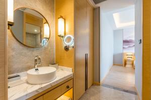 a bathroom with a sink and a mirror at Atour Hotel Shanghai Pudong Jinqiao International Commercial Plaza in Shanghai