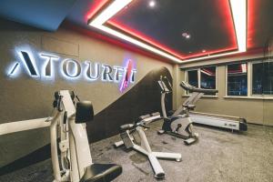 a gym with cardio equipment in a room at Atour S Hotel Shanghai Xujiahui Tianyaoqiao in Shanghai