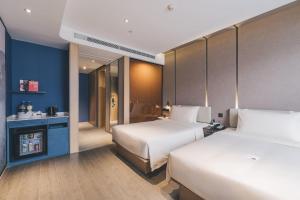 Postel nebo postele na pokoji v ubytování Atour Hotel Shanghai Pudong Jinqiao