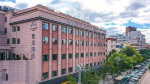 a red building with the words a your hotel on it at Atour Hotel Kunming Cuihu in Kunming +43 photos