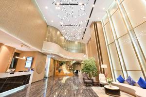 a lobby of a hotel with a chandelier at Atour Hotel Beijing Yizhuang New Town Majuqiao in Daxing