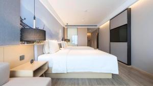 Postel nebo postele na pokoji v ubytování Atour Hotel Chengdu Jiuyanqiao NetEase Selected