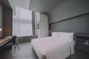 Postel nebo postele na pokoji v ubytování Atour S Hotel Shanghai Hongqiao Center Aegean