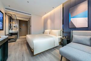 Krevet ili kreveti u jedinici u okviru objekta Atour Hotel Quanzhou Hongchang Baozhou Road