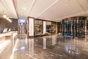 a lobby of a building with a lot of glass at Atour X Hotel Chengdu Shuangnan Wuhou Avenue Station in Chengdu