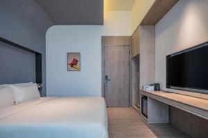 Postel nebo postele na pokoji v ubytování Atour S Hotel Shanghai Hongqiao Center Aegean