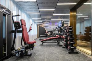 a gym with a row of exercise bikes in it at Atour Hotel Shaoxing Heqiao in Shaoxing