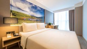Postel nebo postele na pokoji v ubytování Atour Hotel Chengdu Jiuyanqiao NetEase Selected