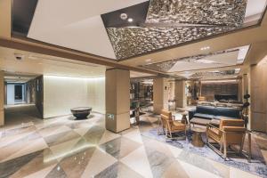 a lobby of a hotel with a salon at Atour Hotel Shanghai The Bund East Nanjing Road in Shanghai