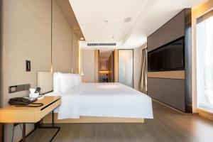 Voodi või voodid majutusasutuse Atour S Hotel Zhuhai Gongbei Port NetEase Selected toas