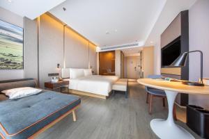 Tempat tidur dalam kamar di Atour Hotel Kunming Nanyue City