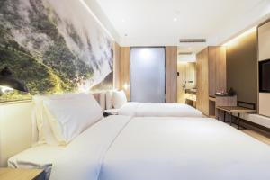 Кровать или кровати в номере Atour Hotel Jinan Zhangqiu Century Avenue