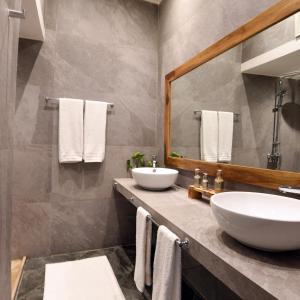 a bathroom with two sinks and a mirror at Riad CK Medina in Marrakech