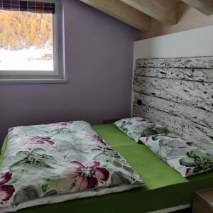 Postel nebo postele na pokoji v ubytování Al Dos