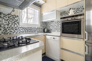 a kitchen with a stove and a sink at Sleek in Istanbul