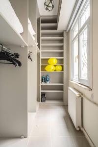 a bathroom with a walk in closet with a window at Sleek in Istanbul