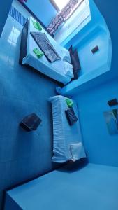 a room with blue walls and a counter top withocolates at villa haroun in Dahab