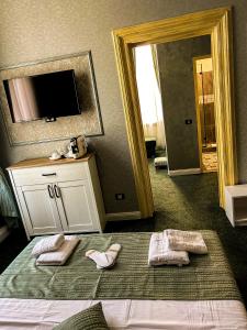 TV a/nebo společenská místnost v ubytování Hotel Boutique Casa Vermont