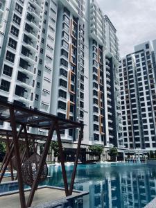 a view of some apartment buildings and a swimming pool at K Avenue with Peak Escapes in Donggongon