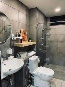 a bathroom with a toilet and a sink and a shower at K Avenue with Peak Escapes in Donggongon