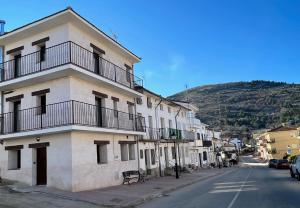 a building with balconies on the side of a street at SIERRA NORTE-TERVILOR in Canencia