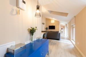 A television and/or entertainment centre at INSIDEHOME Apartments - La Casita de Montse