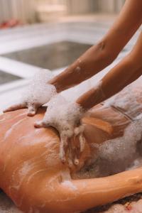 a person is sprinkling powdered sugar on a doughnut at Heybe Hotel & Spa in Goreme