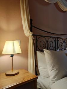 Postel nebo postele na pokoji v ubytování Kastalia Country Home
