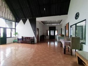 a large room with tables and chairs in a building at Villa Cisarua Kerucut in Brujul +19 photos