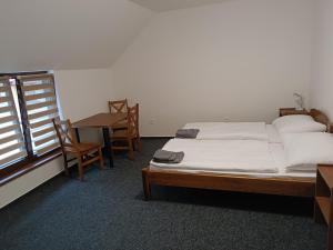 Кровать или кровати в номере Penzion Kotva