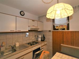 a kitchen with a sink and a light fixture at Apartment Höllwarth by Interhome in Fügenberg