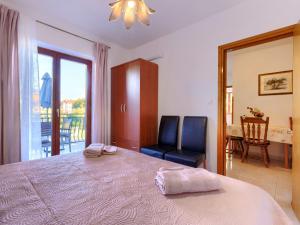 Postel nebo postele na pokoji v ubytování Apartment Alba-5 by Interhome