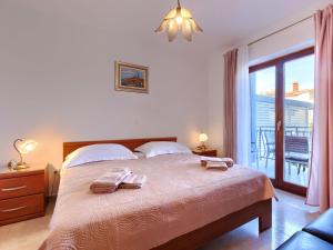 Postel nebo postele na pokoji v ubytování Apartment Alba-5 by Interhome