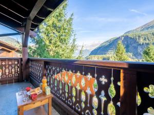 a balcony with a view of the mountains at Apartment Les Hauts des Chavants - by Interhome in Les Houches