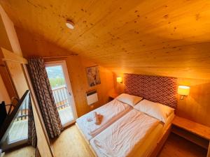 Voodi või voodid majutusasutuse Chalet Klippitz - Perle by Interhome toas