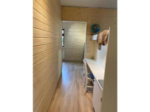 a room with a hallway with wooden walls at Holiday Home The cozy loggers suite by Interhome in Salla +9 photos