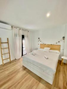 A bed or beds in a room at Loft Alameda en Sevilla
