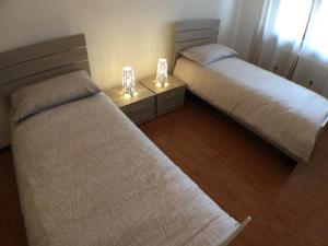 A bed or beds in a room at Appartamenti Giacomo Noventa